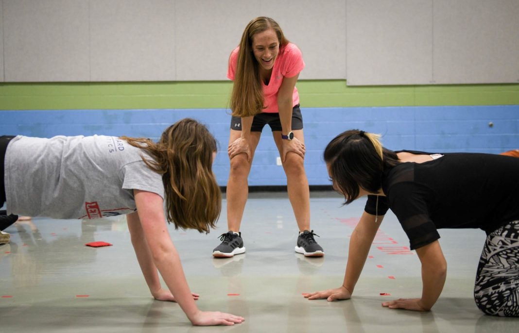 PE Teacher Angela Stark Watches As Marianne Gebb Left And Sofia Wu 